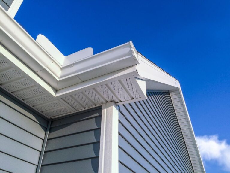 House with new cladding, white fascia's and white guttering