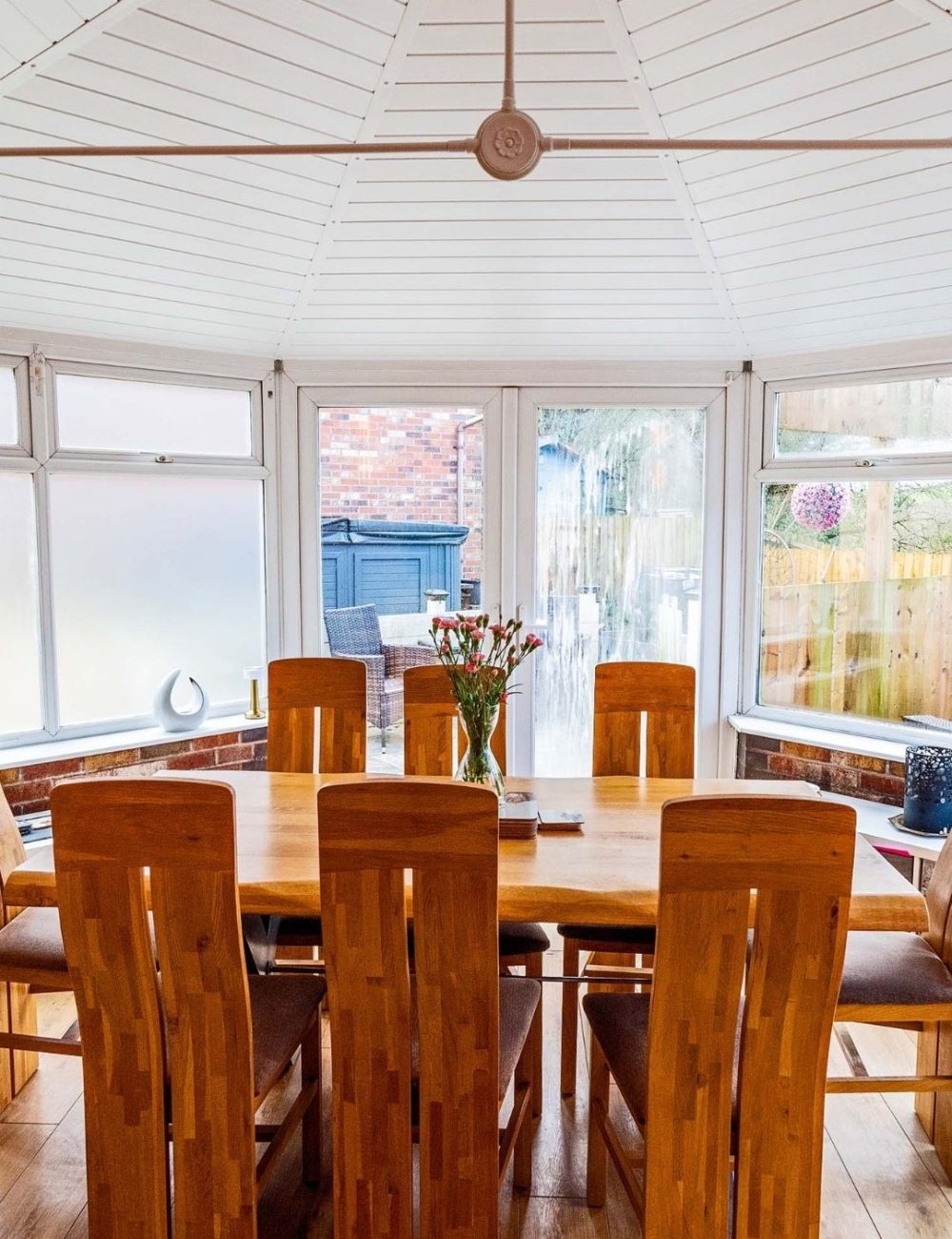 conservatory with dining room table in with conservatory insulation installed